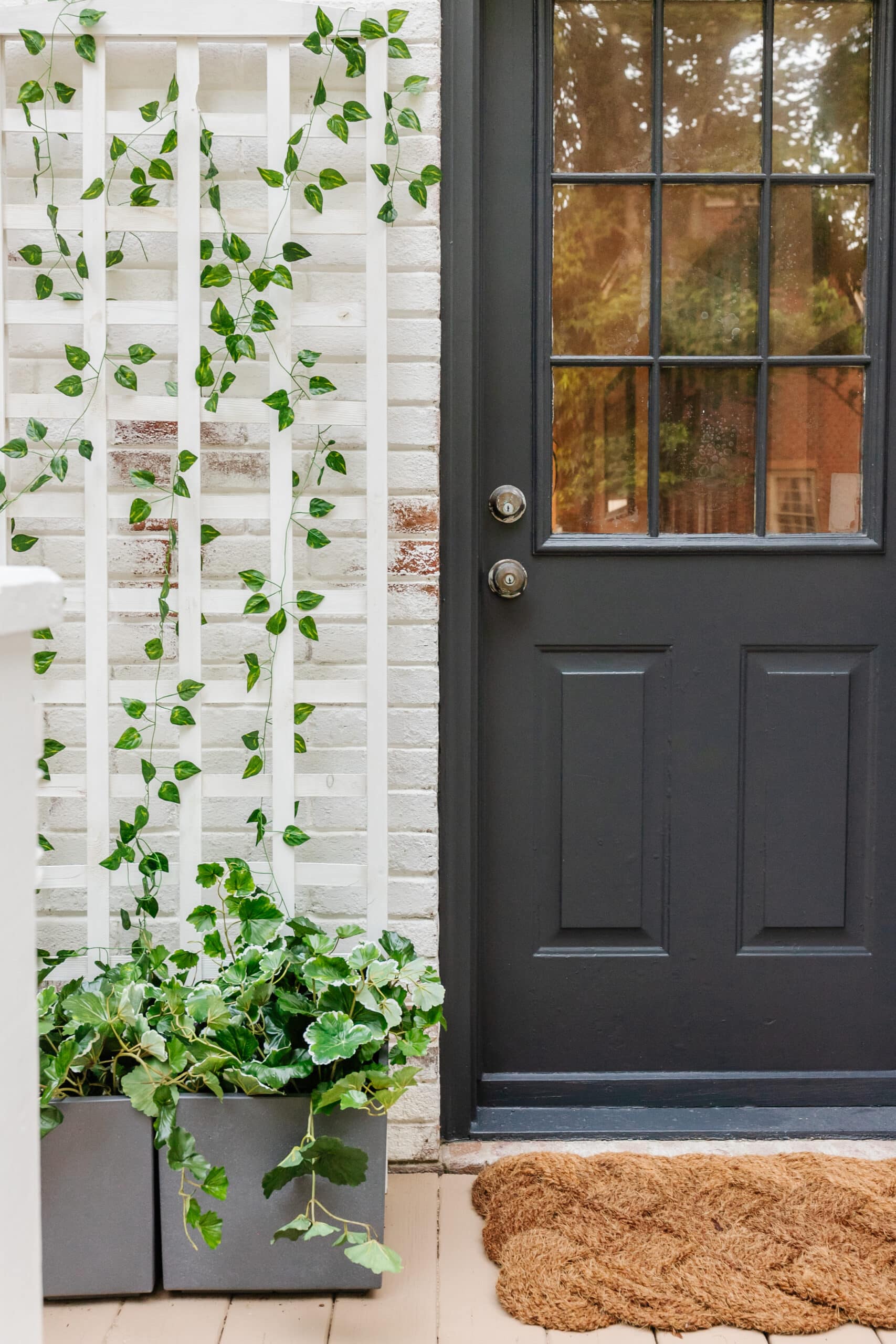 side porch planter with trellis and side door and limewashed brick