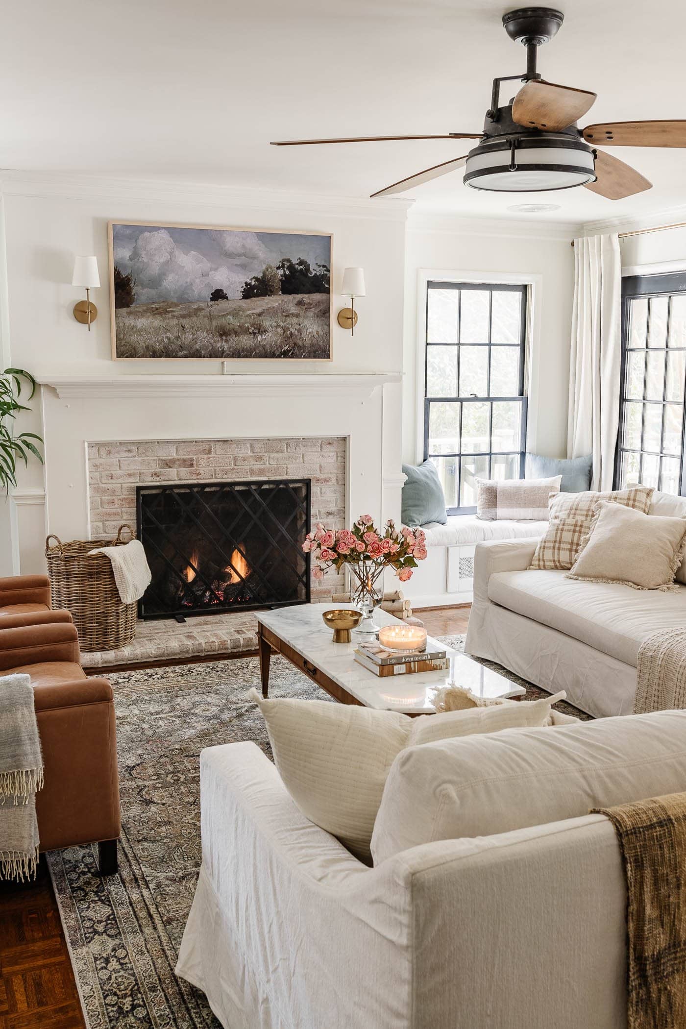 white living room decorated for spring with marble coffee table