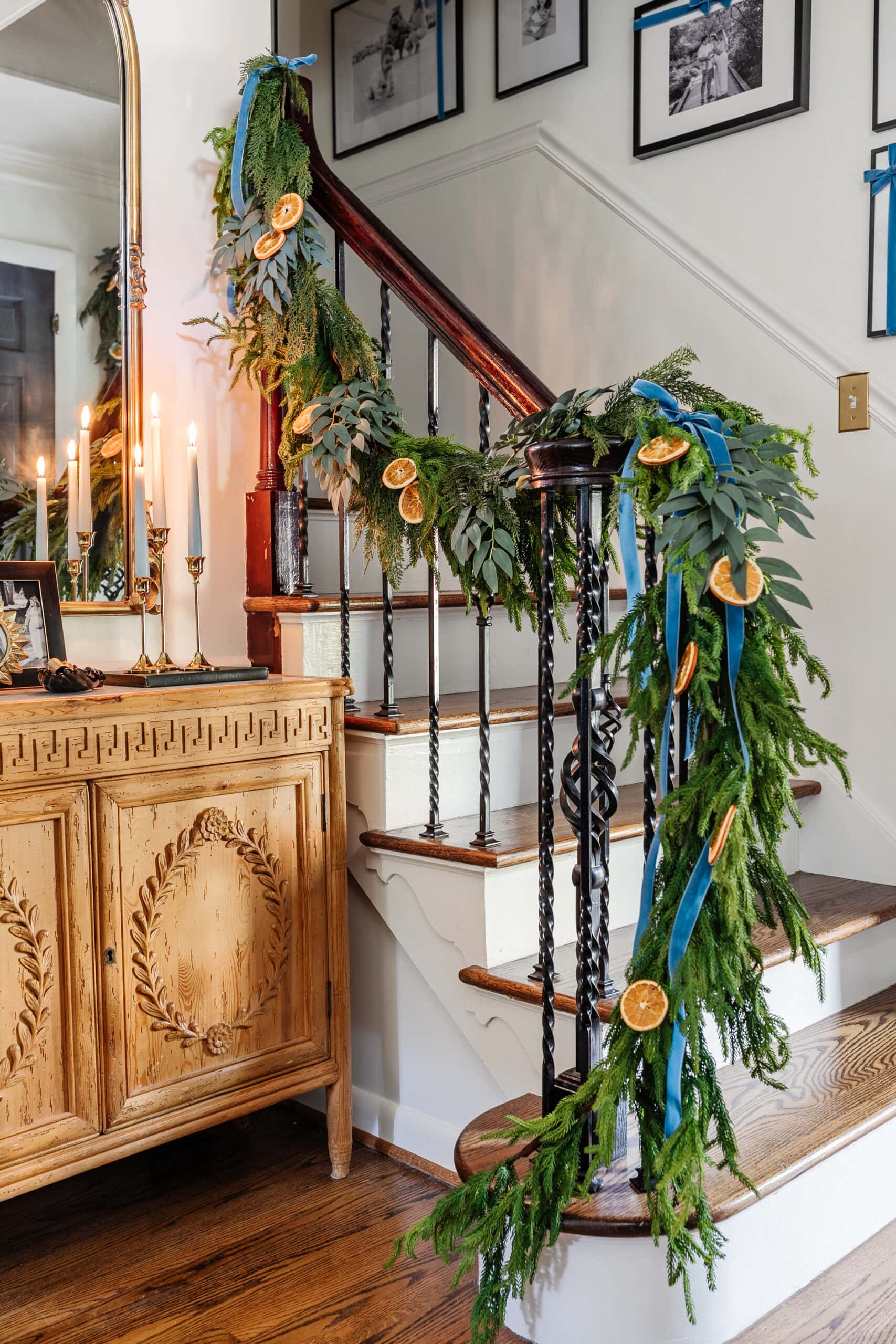 layered garland on stairs railing
