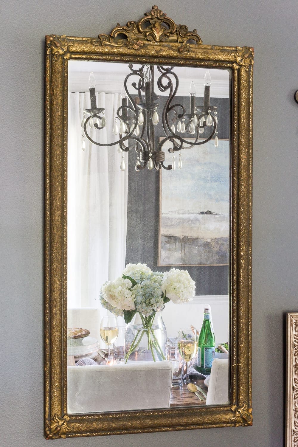 mirror in a dining room with a dining table reflection