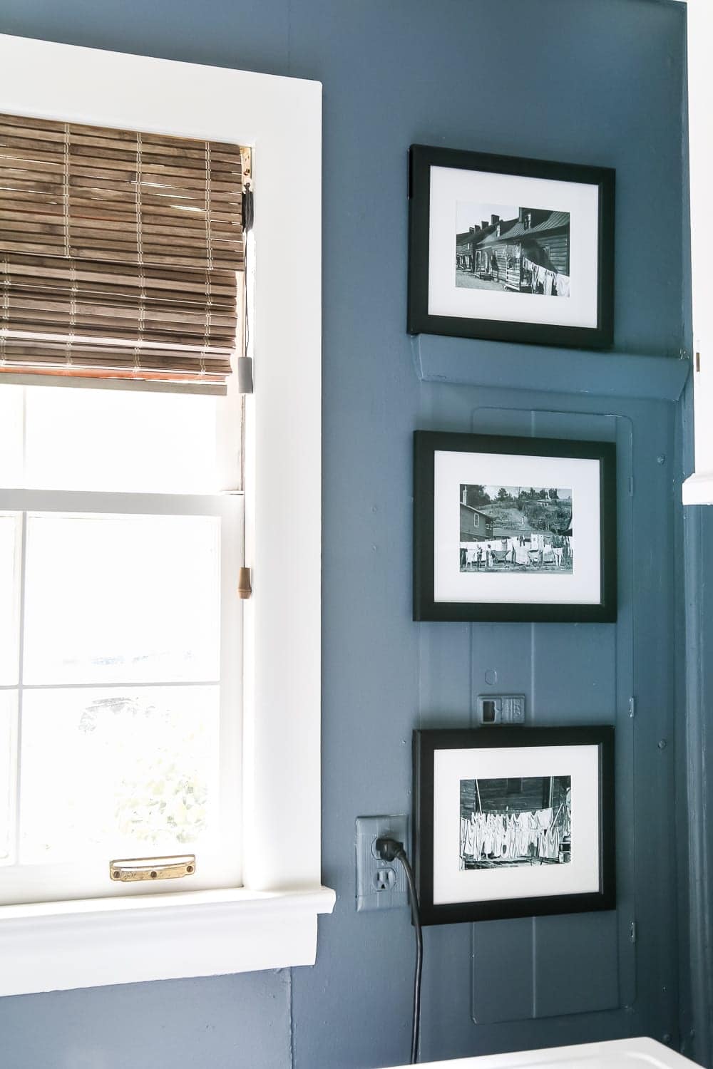 Paint your breaker box the same color as the wall and place magnetic frames on top. 