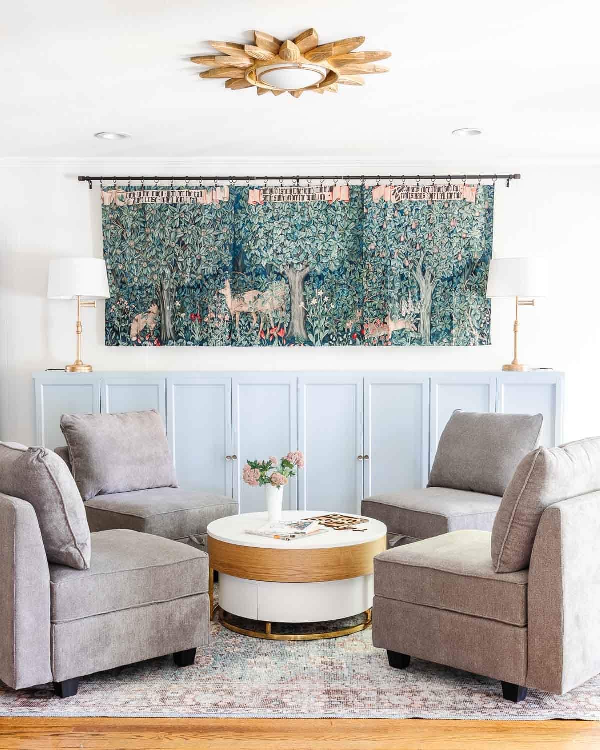 how to make your house look expensive - put toys in bins and cabinets - playroom cabinets with tapestry and modular chairs