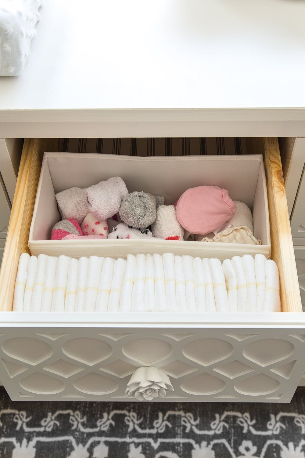 Nursery Organization | Dresser drawers with dividers to store diapers, socks, and mittens