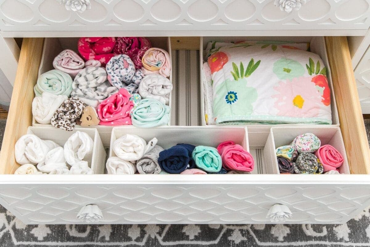 Nursery Organization | Dresser drawers with dividers to store clothing in categories.