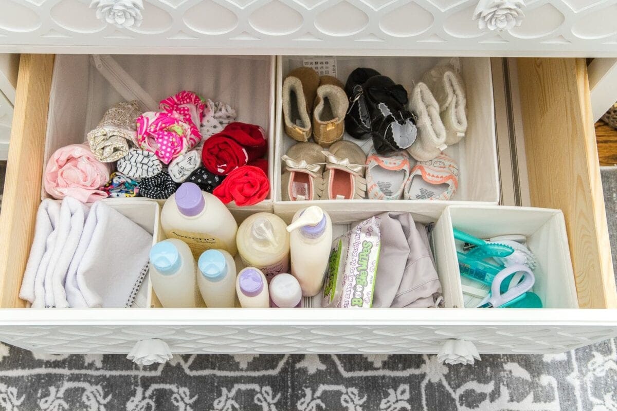 Nursery Organization | Dresser drawers with dividers to store baby soap, grooming kit, changing pads, shoes, and diaper pail bags.