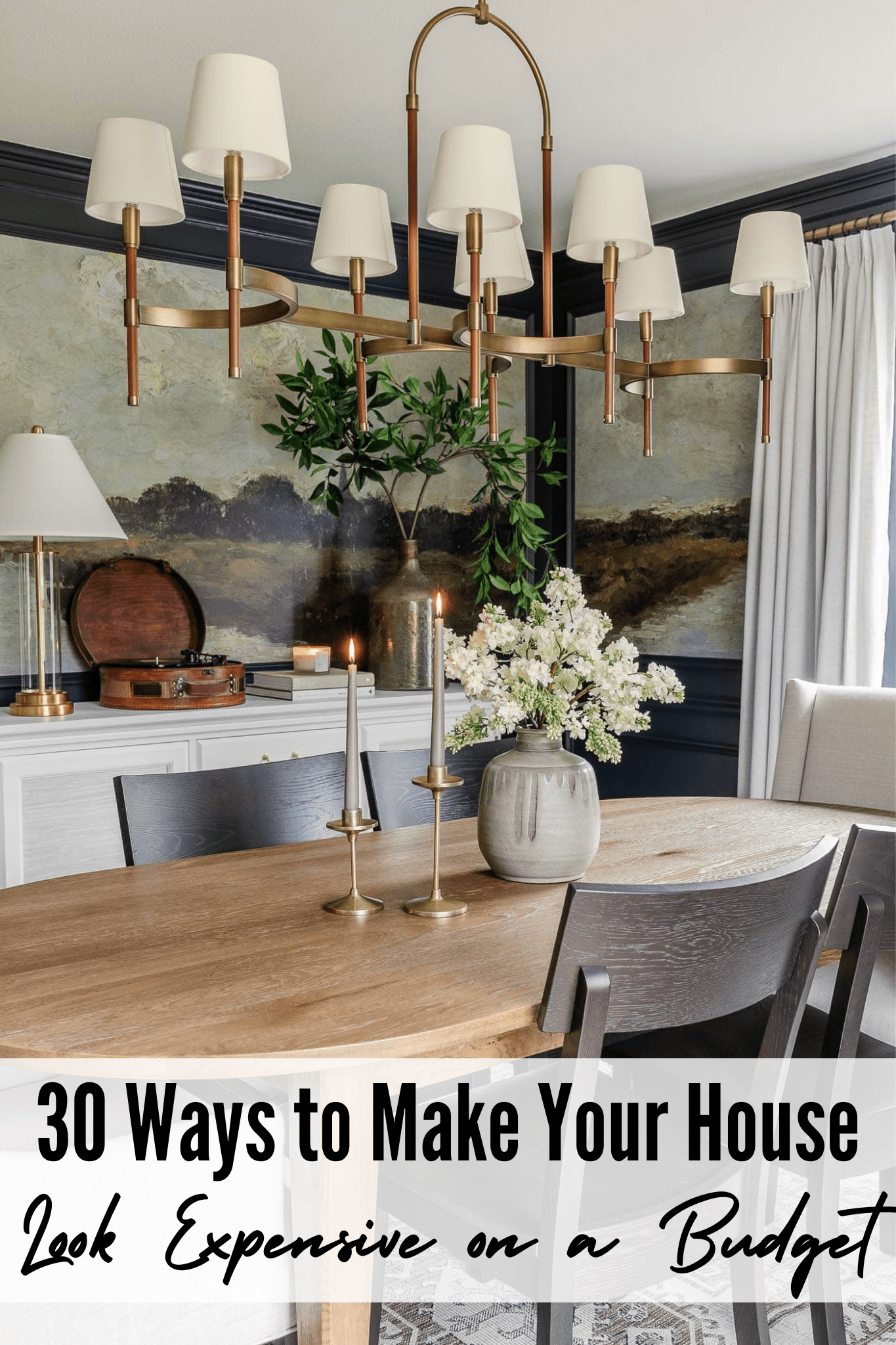 30 ways to make your house look expensive on a budget - dining room with navy blue paint and mural wallpaper