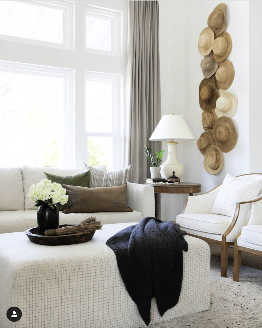hats hanging on a wall for diy wall decor in a living room