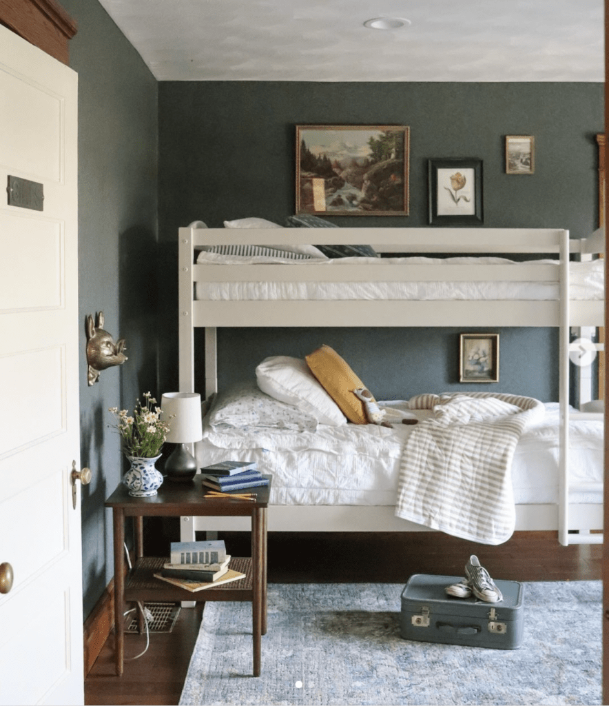 gender neutral cottage bunk bed small room with antique accessories and vintage art