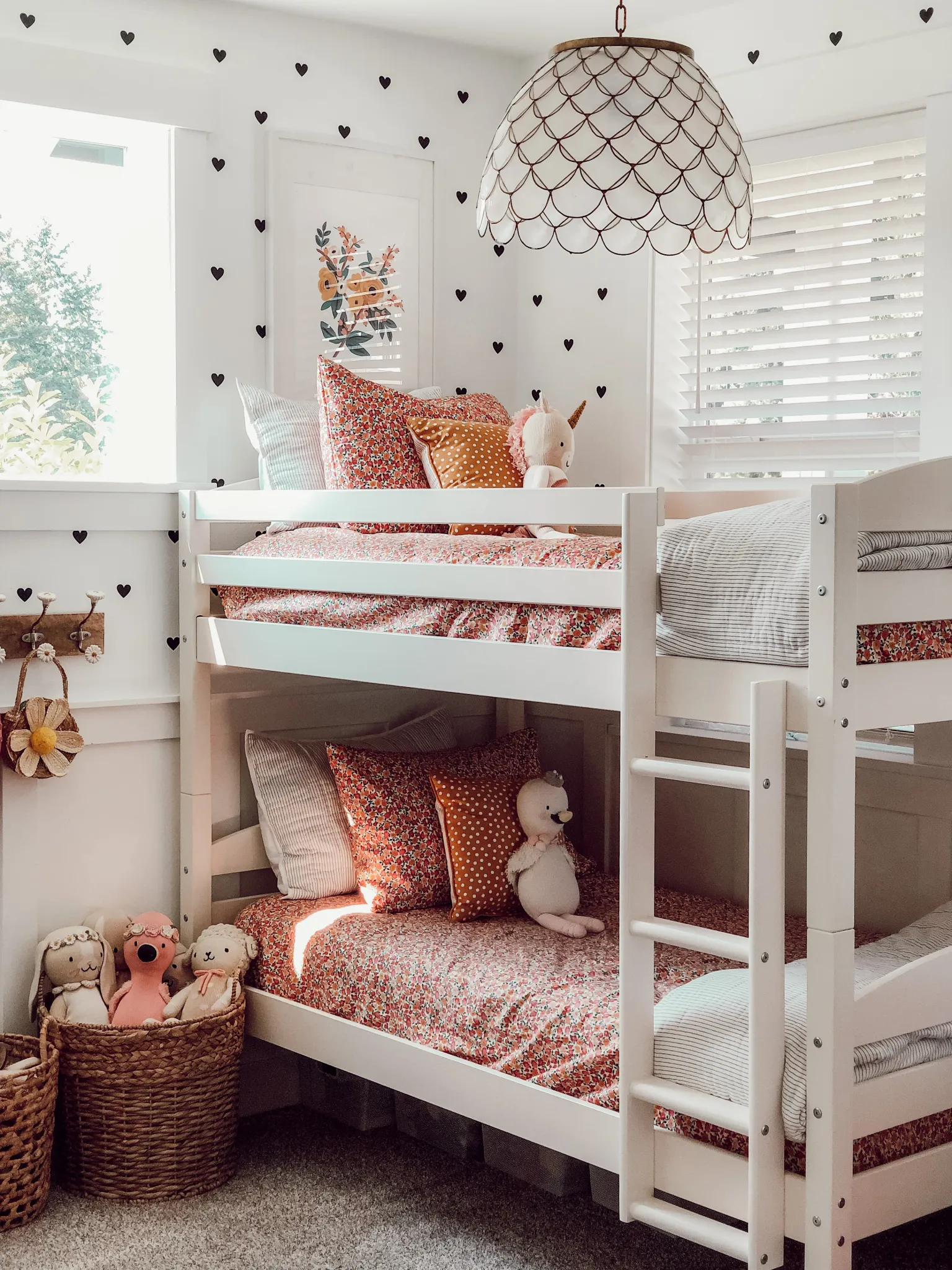 simple feminine bedding and white walls in a small bedroom