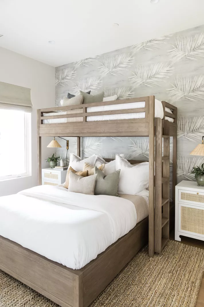 coastal style shared bedroom with twin over full bunk beds for 3 people